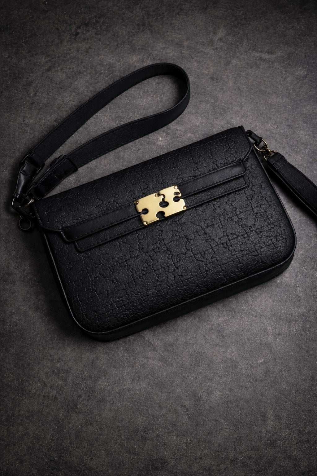 Puzzle leather clutch bag